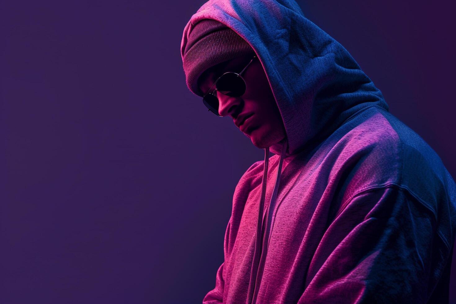 Deep Violet Background with Hoodie Clad Male Lifestyle portrait Highlighting Fashion Trends and Stylish Wear photo