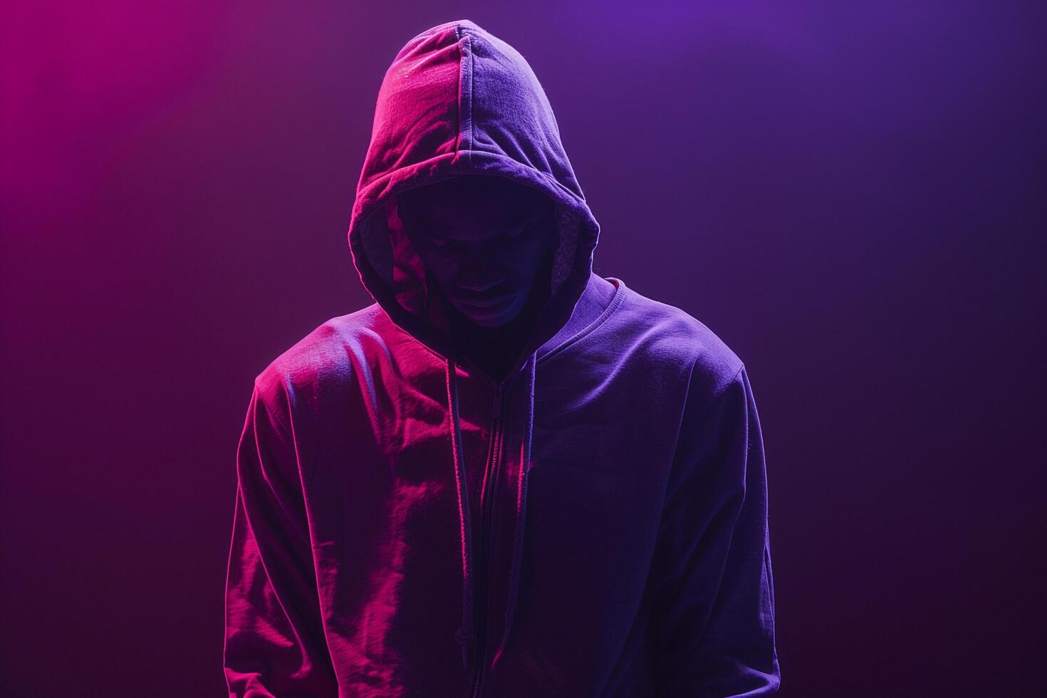 Deep Violet Background and Hoodie Clad Male Lifestyle portrait emphasizing Fashion Trends and Contemporary Style photo