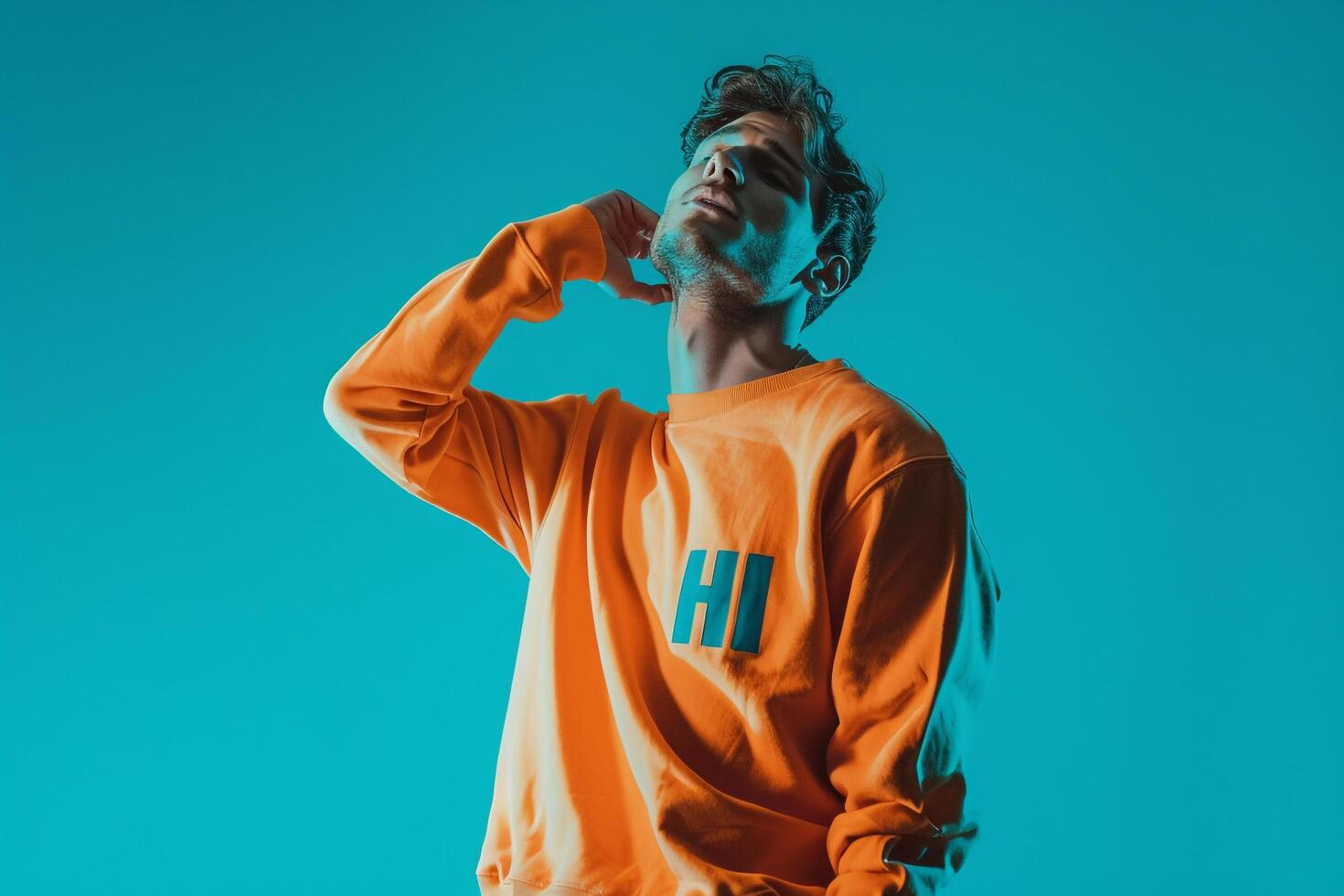 sweatshirtmale dress shot with a turquoise Males backgroundhighlighting lifestyle and fashion portrait style photo