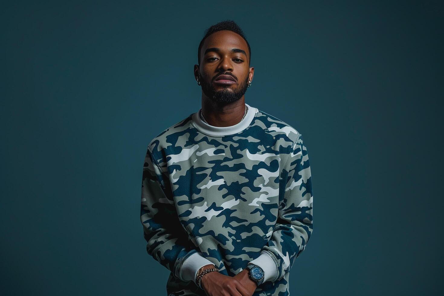 printed sweatshirtmale dress shot with a graphite blue Males backgroundemphasizing lifestyle and fashion portrait style photo