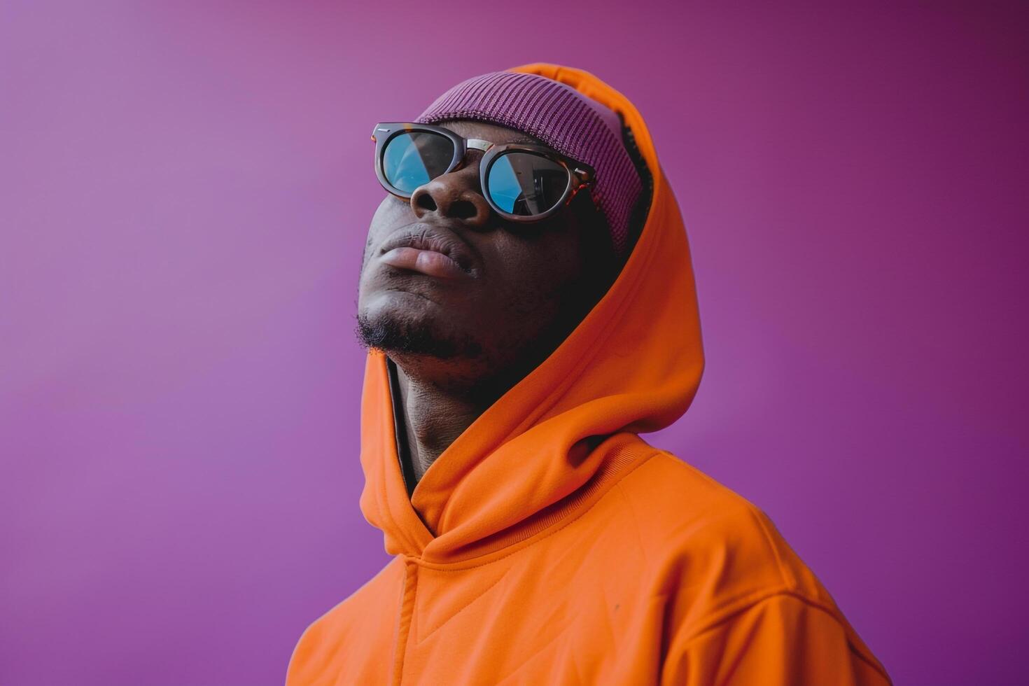 Bright purple Background Featuring Streetwear pullover Clad Male Lifestyle portrait emphasizing Fashion and Chic eleMalets photo