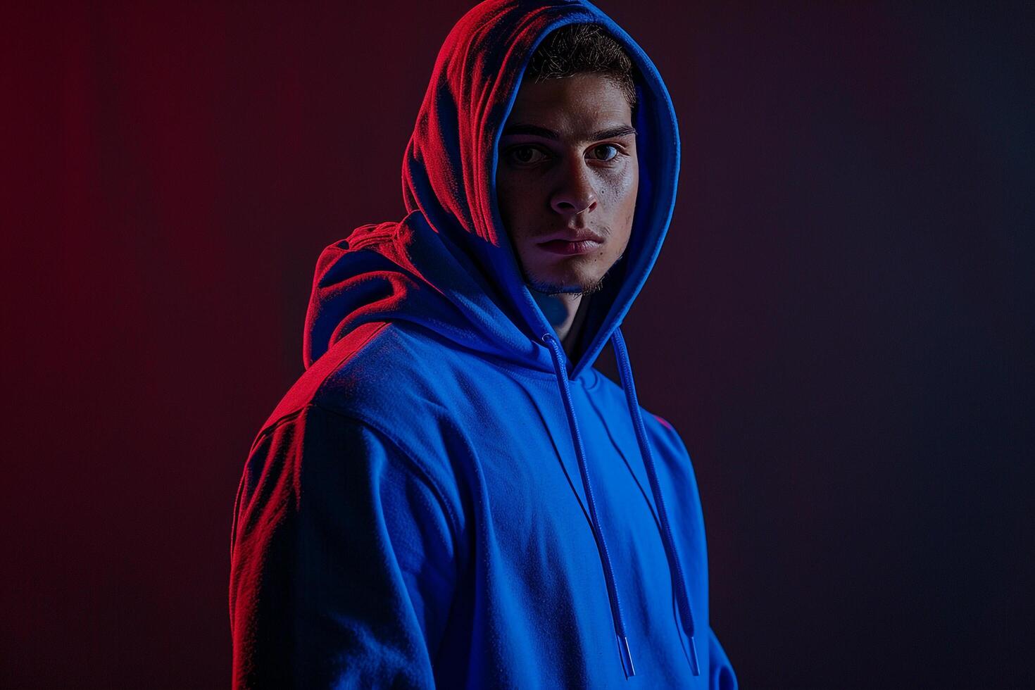 Cobalt Blue Hoodie on Male with Midnight Black Background Fashion and Lifestyle portrait photo