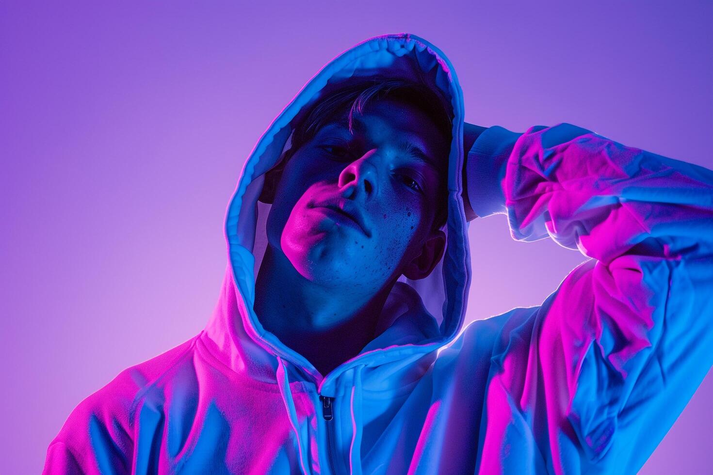 Bright purple Background Hoodie Clad Male Fashion portrait Highlighting Contemporary and Trendy Lifestyle photo