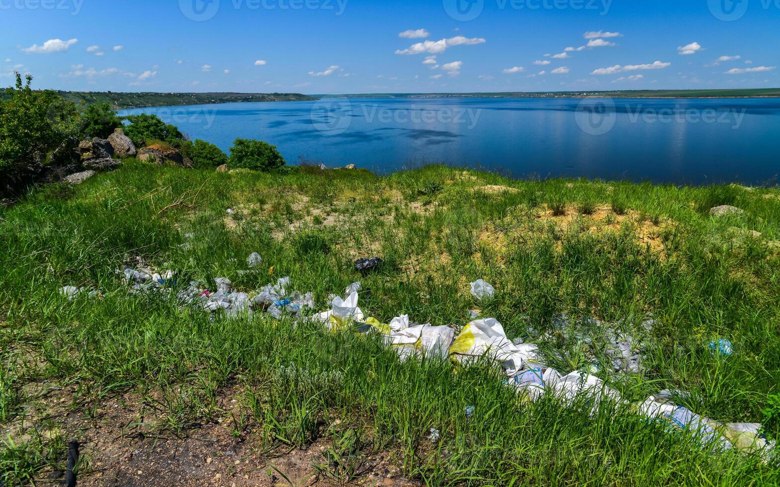 Environmental problem, pollution of the shores of a reservoir with construction and plastic waste, Khadzhibey estuary photo
