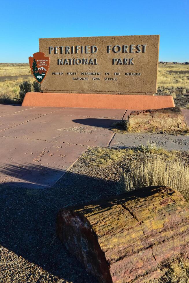 USA, PHENIX, ARIZONA- NOVEMBER 17, 2019 information sign with the name of the park Petrified Forest National Park, Arizona photo