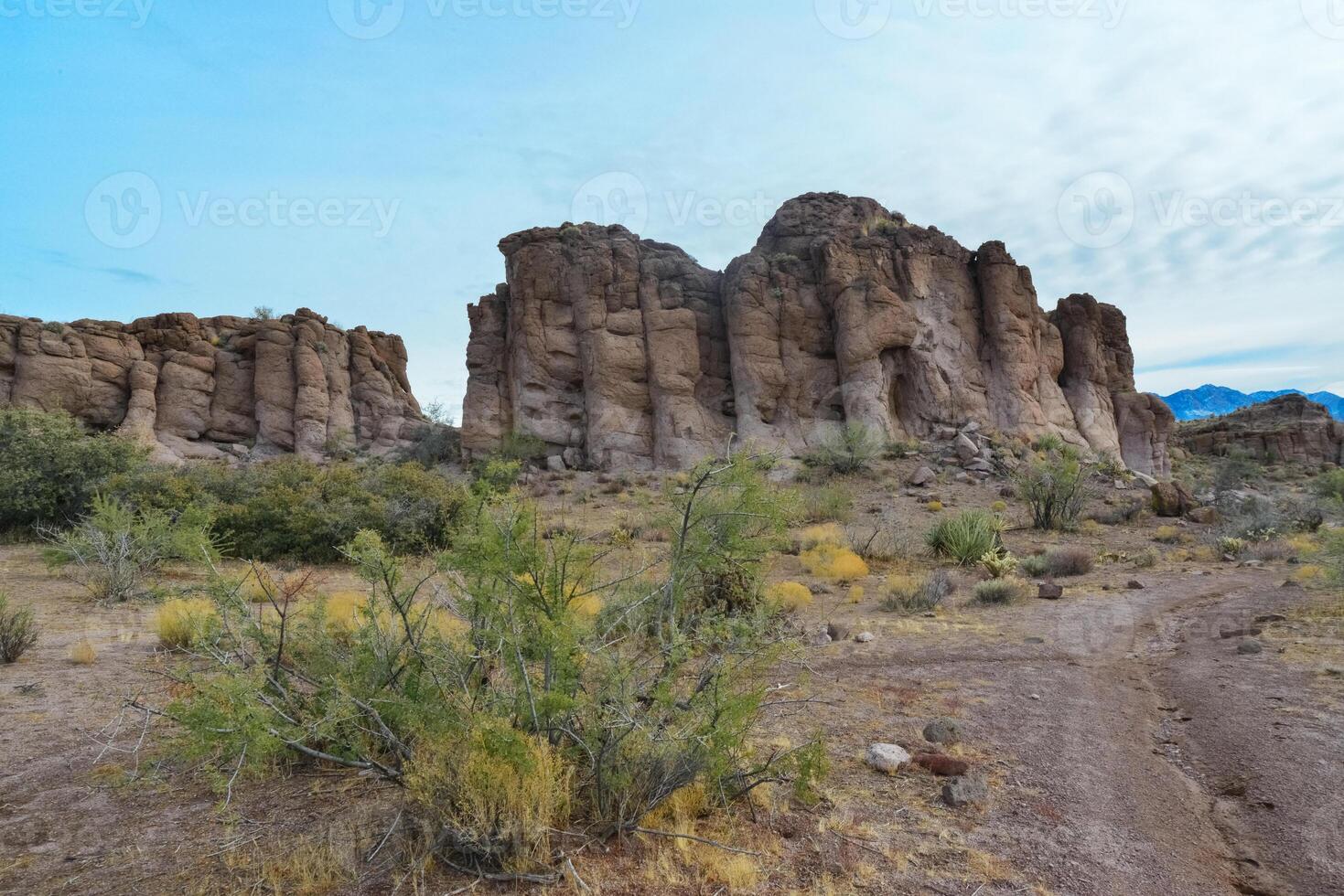 Mountain erosion formations of red mountain sandstones, Desert landscape with cacti, Arizona photo