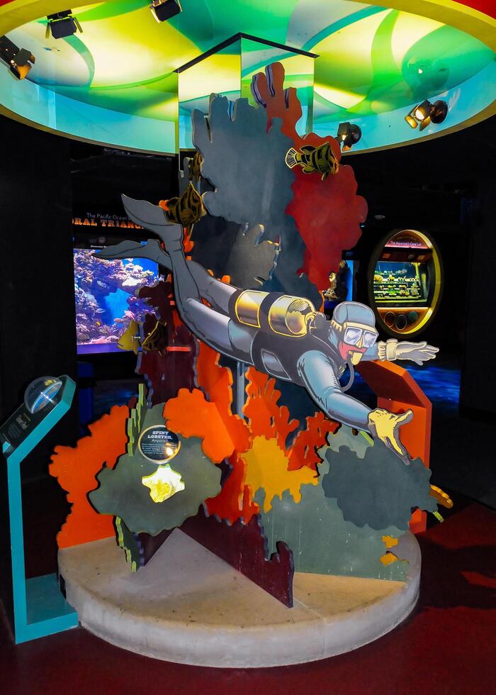 NEW YORK, USA - DECEMBER 06, 2011 information structure with a model of a diver in the interior of the aquarium, New York photo