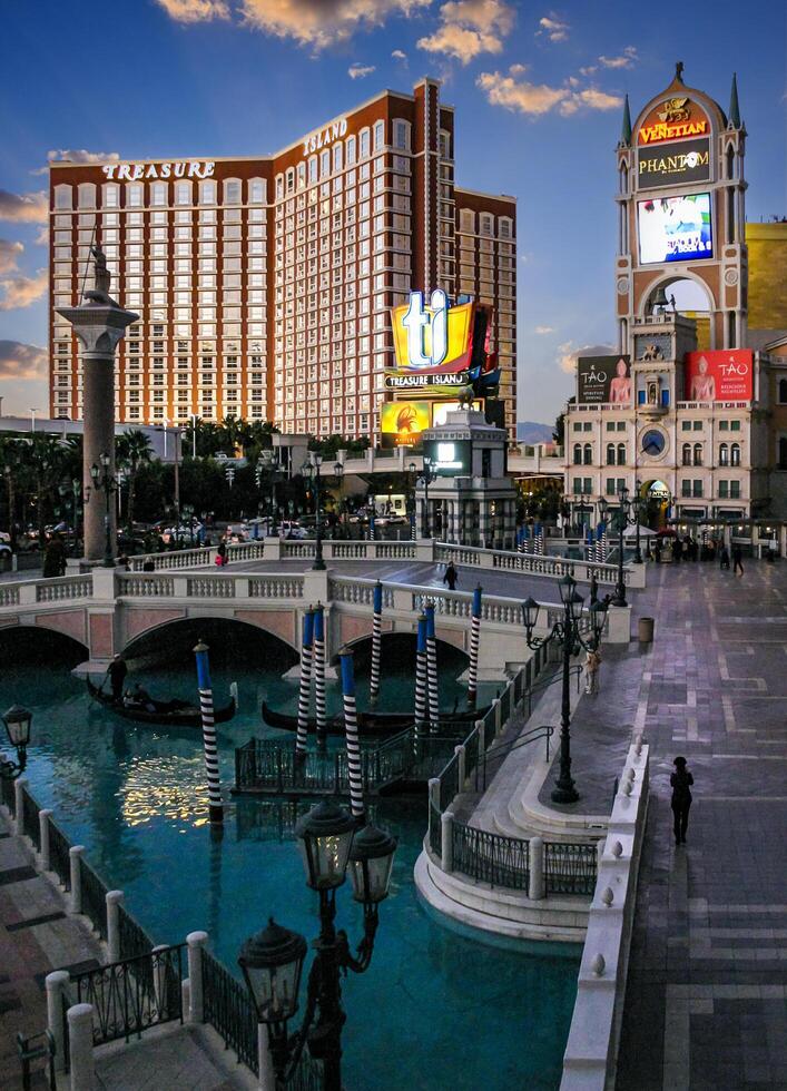 Las Vegas, Nevada - November 30, 2009 The mirage and treasure island hotels standing tall on the las vegas strip photo