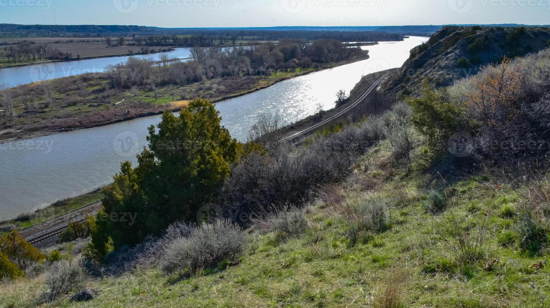 Valley with a slowly flowing river, glare of the sun. Montana nature photo