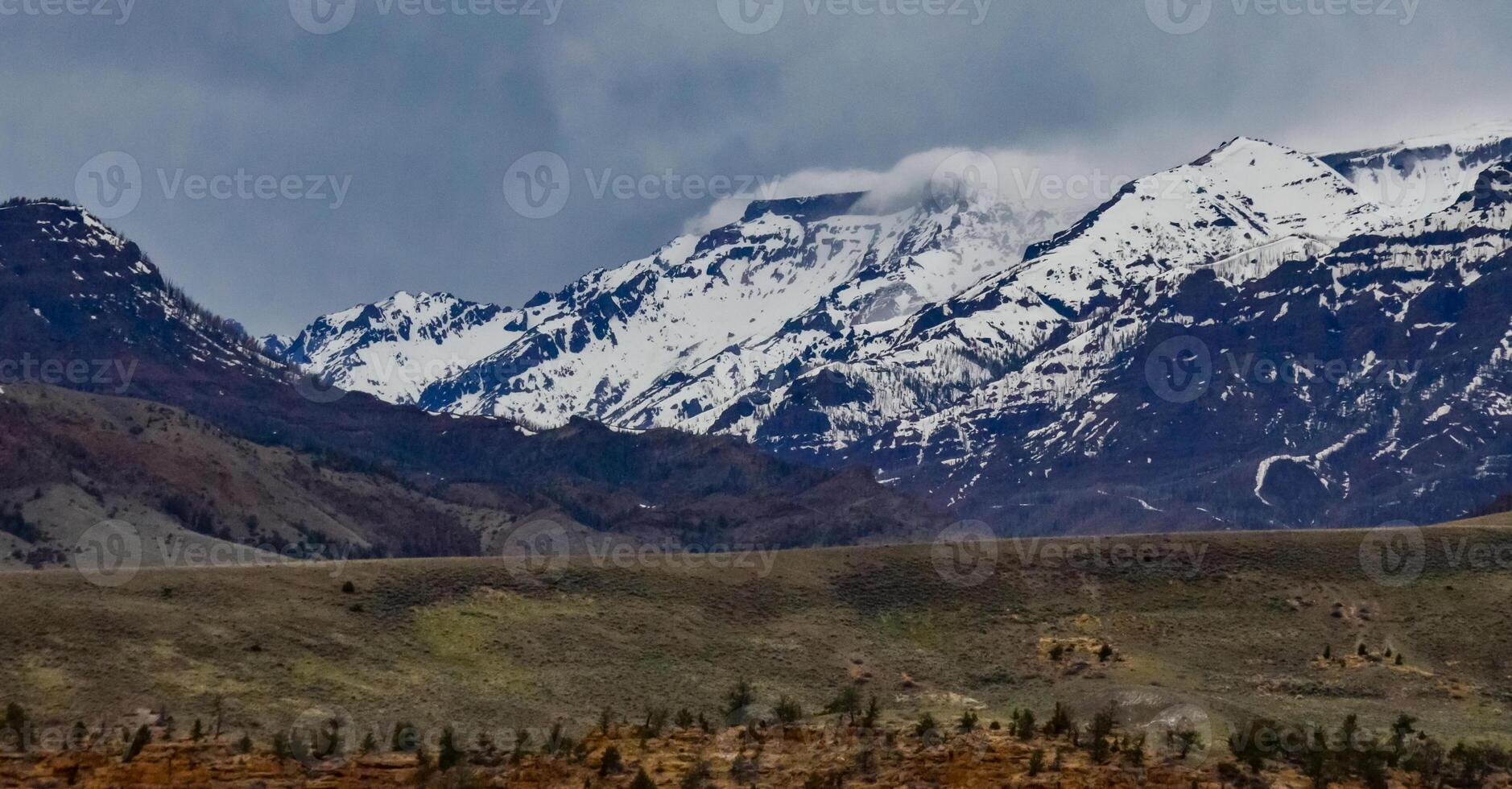 Mountain landscape, snow in the mountains in spring in Montana photo