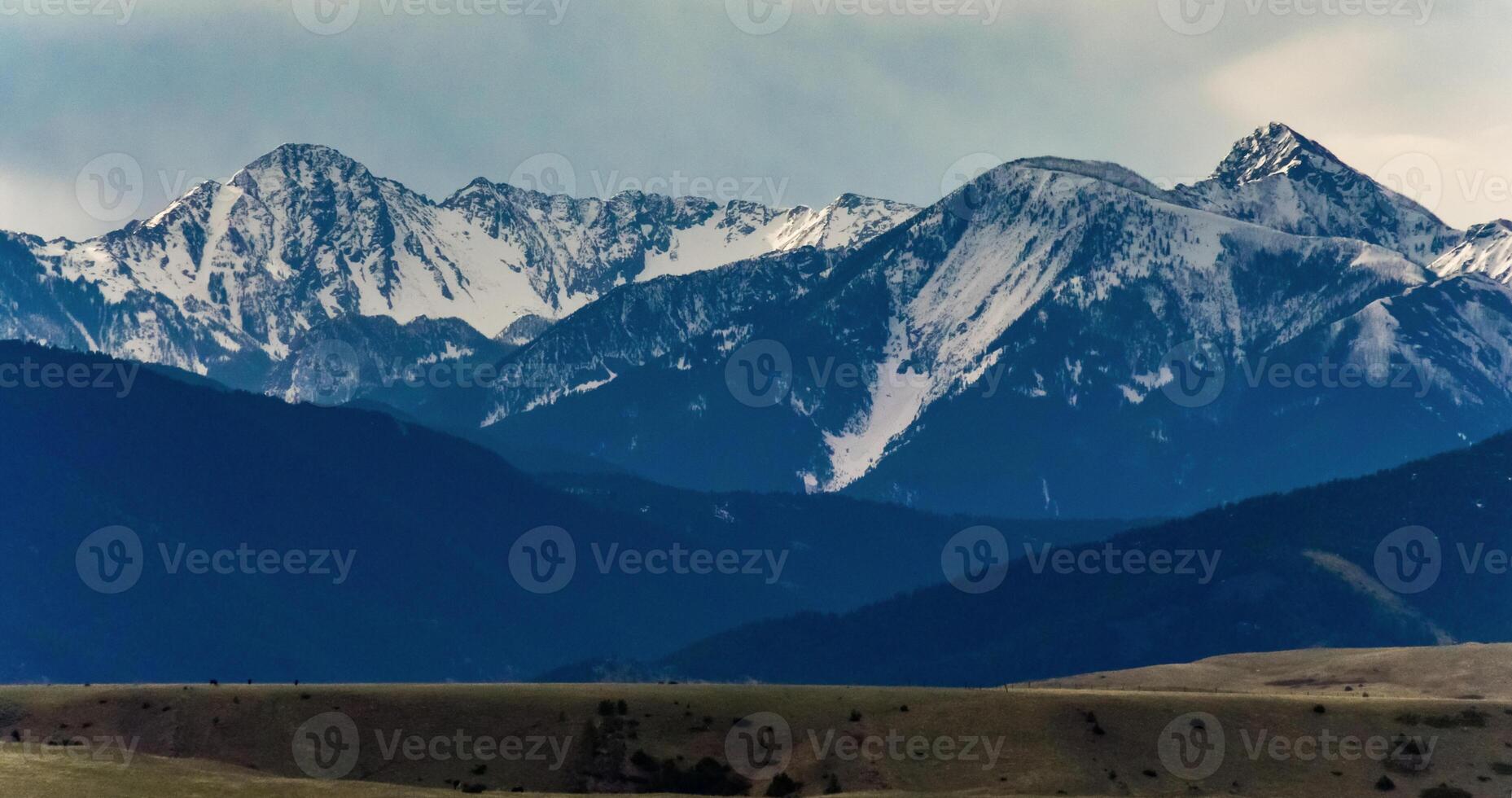 Mountain landscape, snow in the mountains in spring in Montana photo