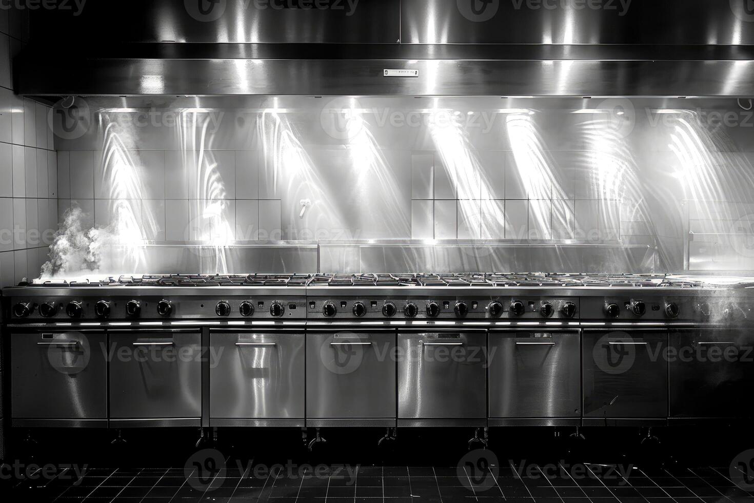 Commercial Kitchen Range With Steam and Light Reflections photo