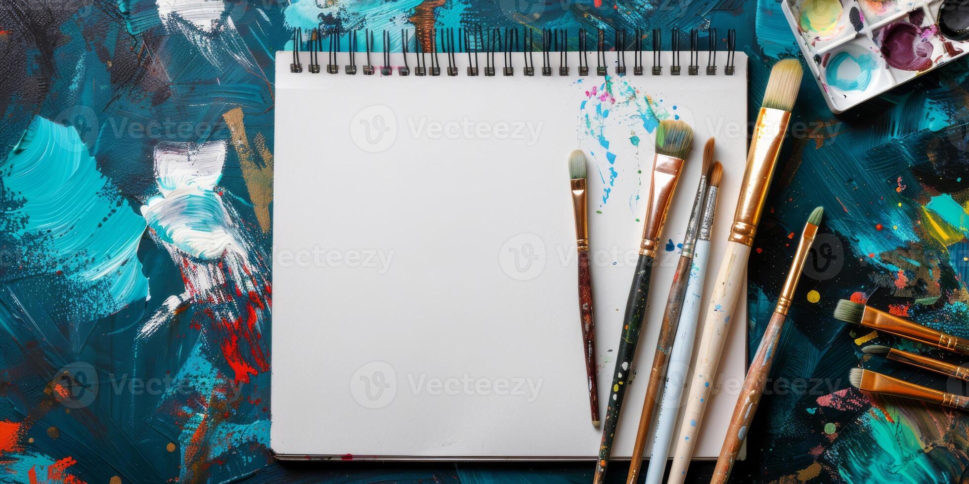 This inspiring mockup features a blank canvas surrounded by brushes and vibrant paints, ideal for creative projects and artistic expressions, perfect for artists wanting to ignite their imagination photo