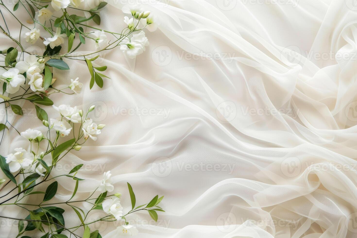 A soft, elegant white fabric gently draped with delicate flowers, creating a serene and inviting atmosphere for all photo