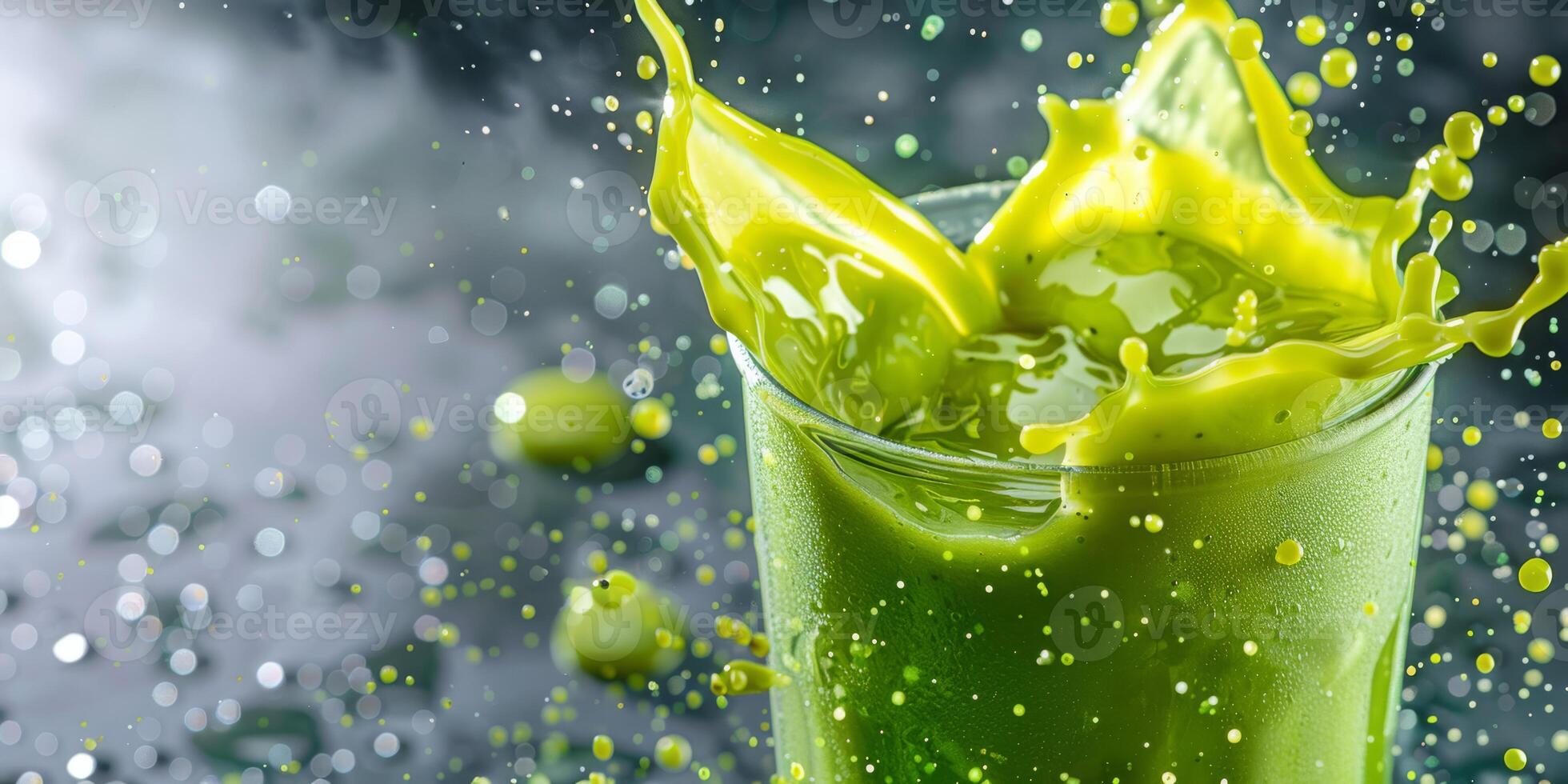 A vibrant splash of a green smoothie captures the amazing essence of freshness and optimal health. Bursting with vitality and flavor, this delicious drink energizes and rejuvenates your body and mind photo