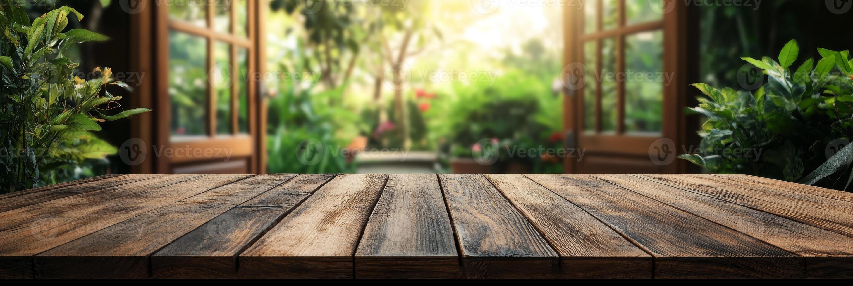 An empty wooden tabletop sits elegantly against a serene, softly blurred garden background, ideal for effectively showcasing products in a beautifully natural and inviting setting photo