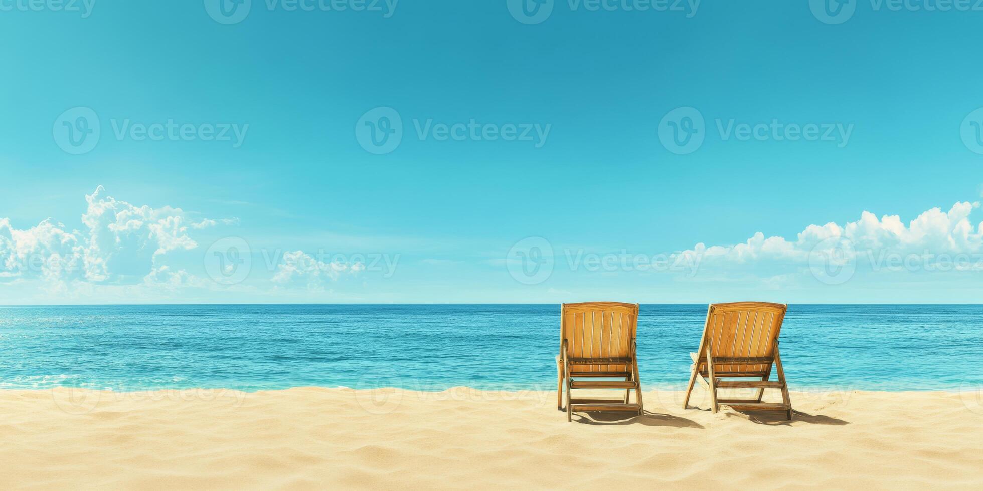 A relaxing beach scene featuring comfortable chairs positioned to face a tranquil ocean under clear blue skies photo