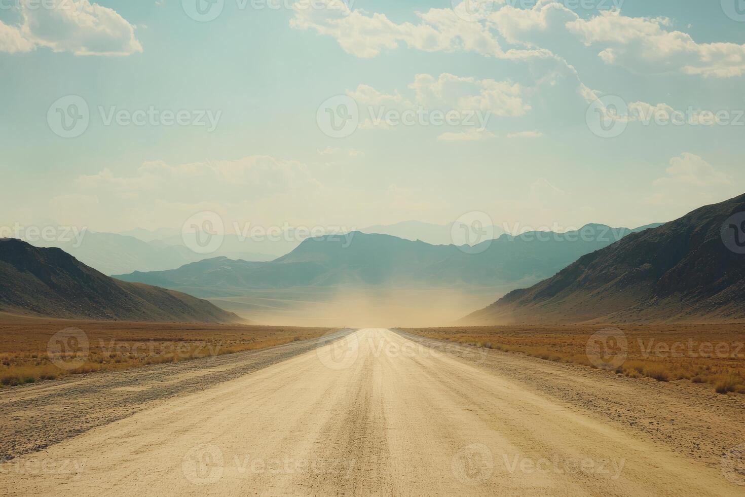 A serene gravel road winds through the arid landscape, leading to majestic mountains under a bright sky, with dust swirling in the warm sunlight, capturing the essence of solitude and freedom photo