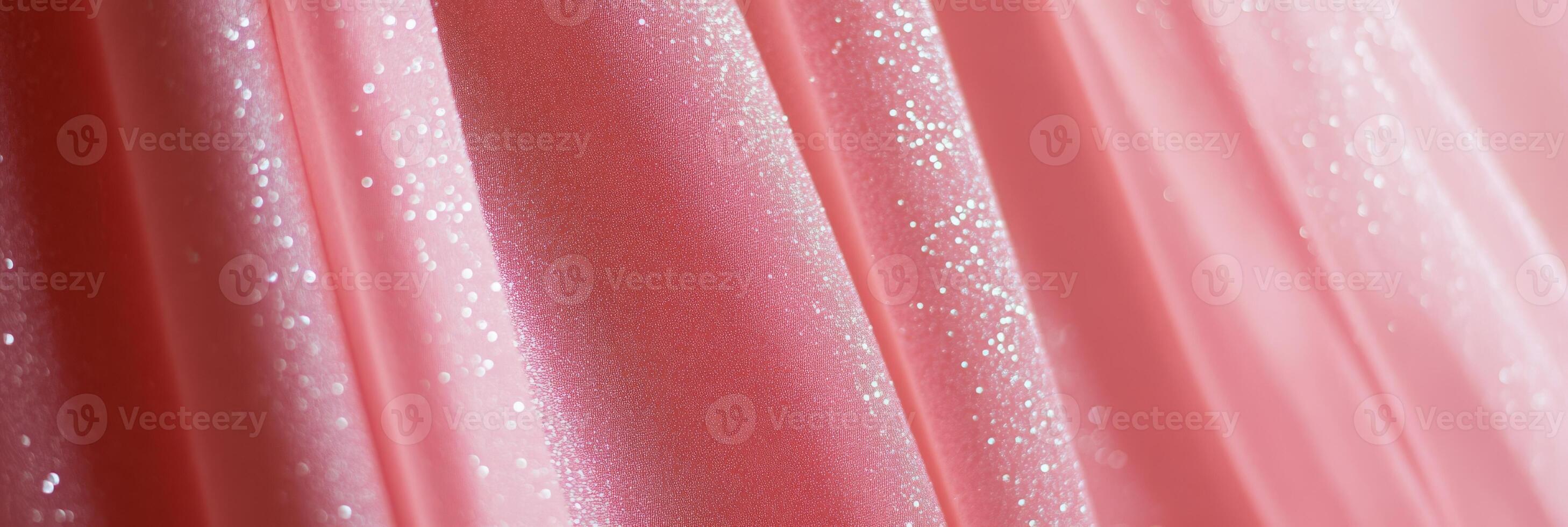 This delicate pink fabric has a shimmering texture, making it ideal for fashion and textile design projects photo