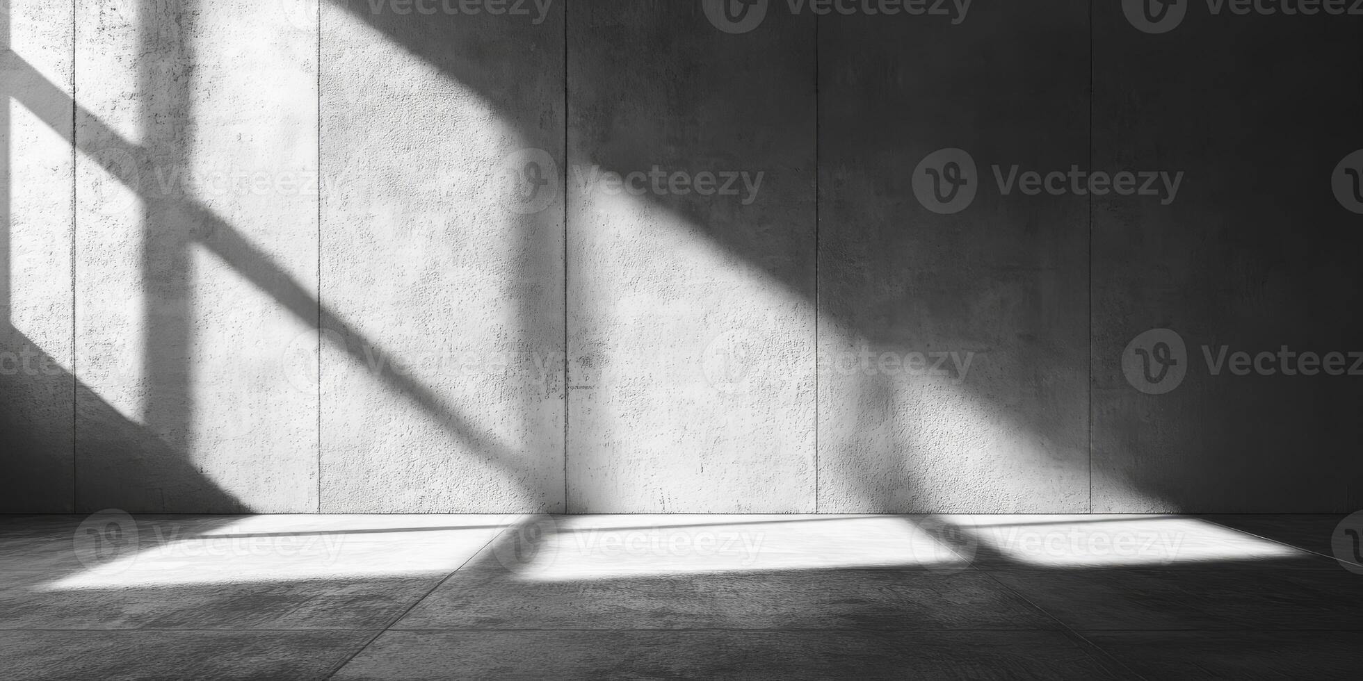 A beautifully minimalist concrete space that showcases intricate light and shadow patterns, making it an ideal setting for product showcases, art exhibitions, and impressive presentations photo