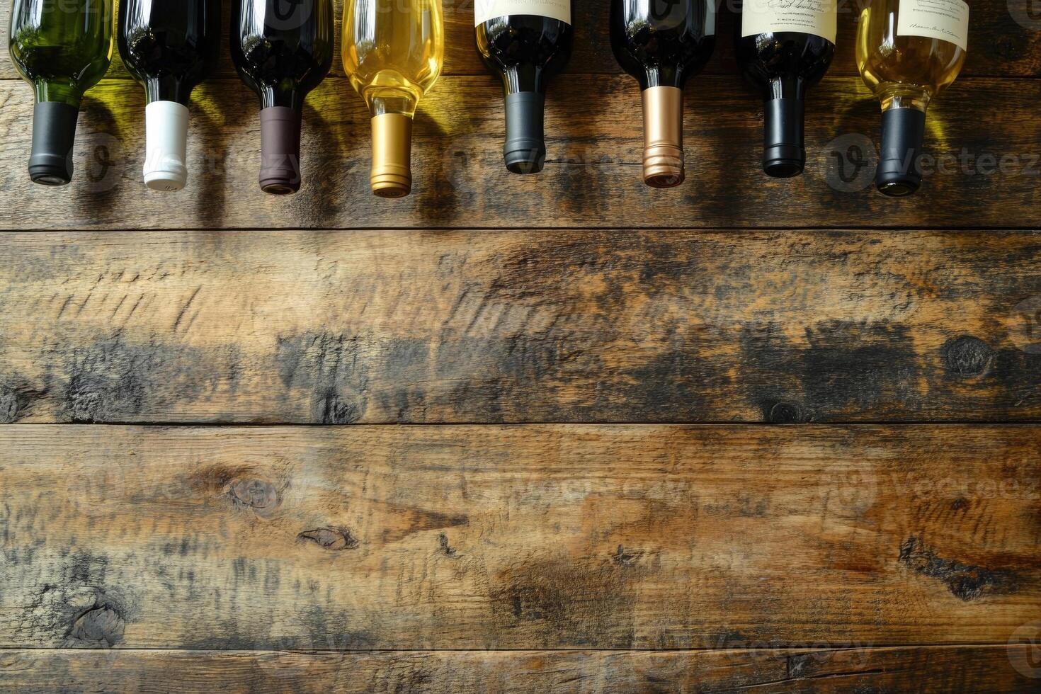 Wine bottles on a wooden table with a blank space. photo