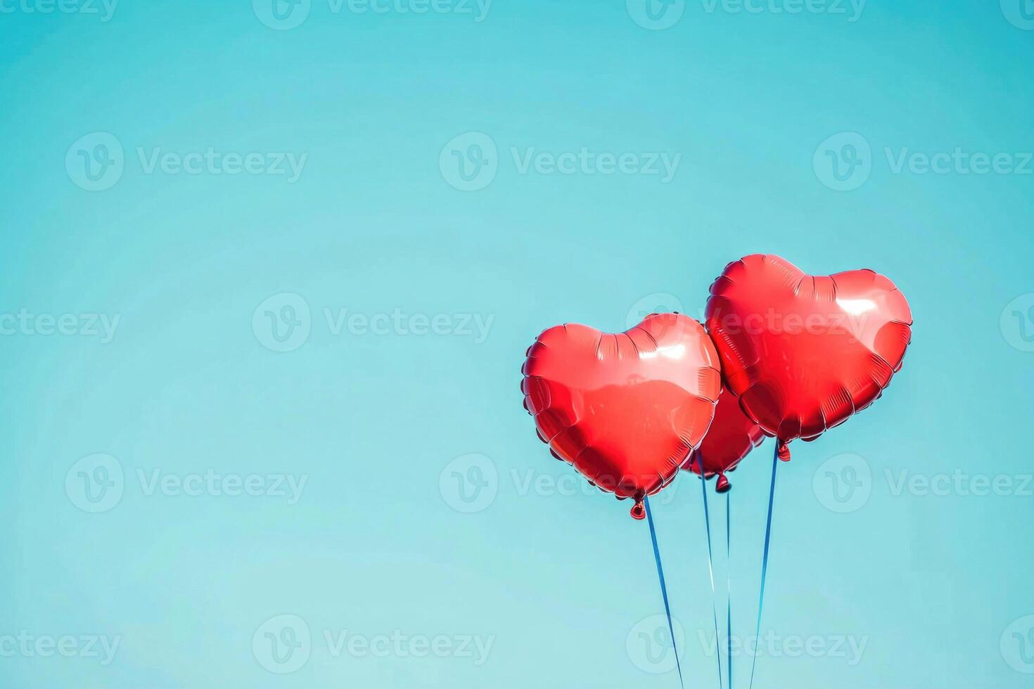 Heart-shaped balloons against a clear sky with text space. photo