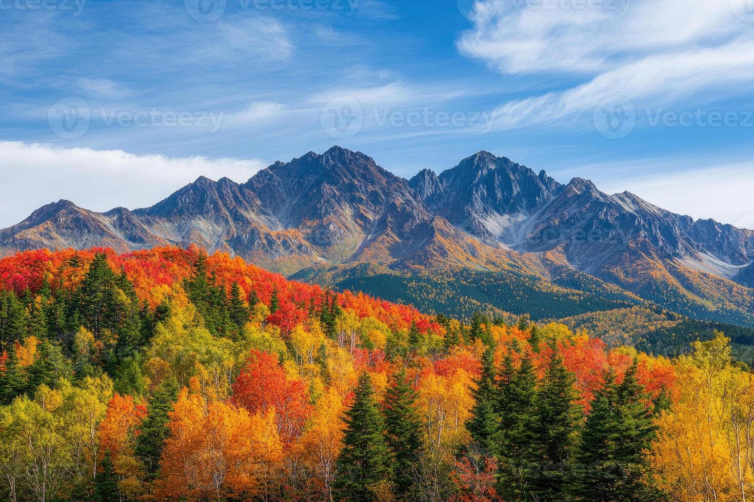 A breathtaking mountain range adorned with autumn colors. photo