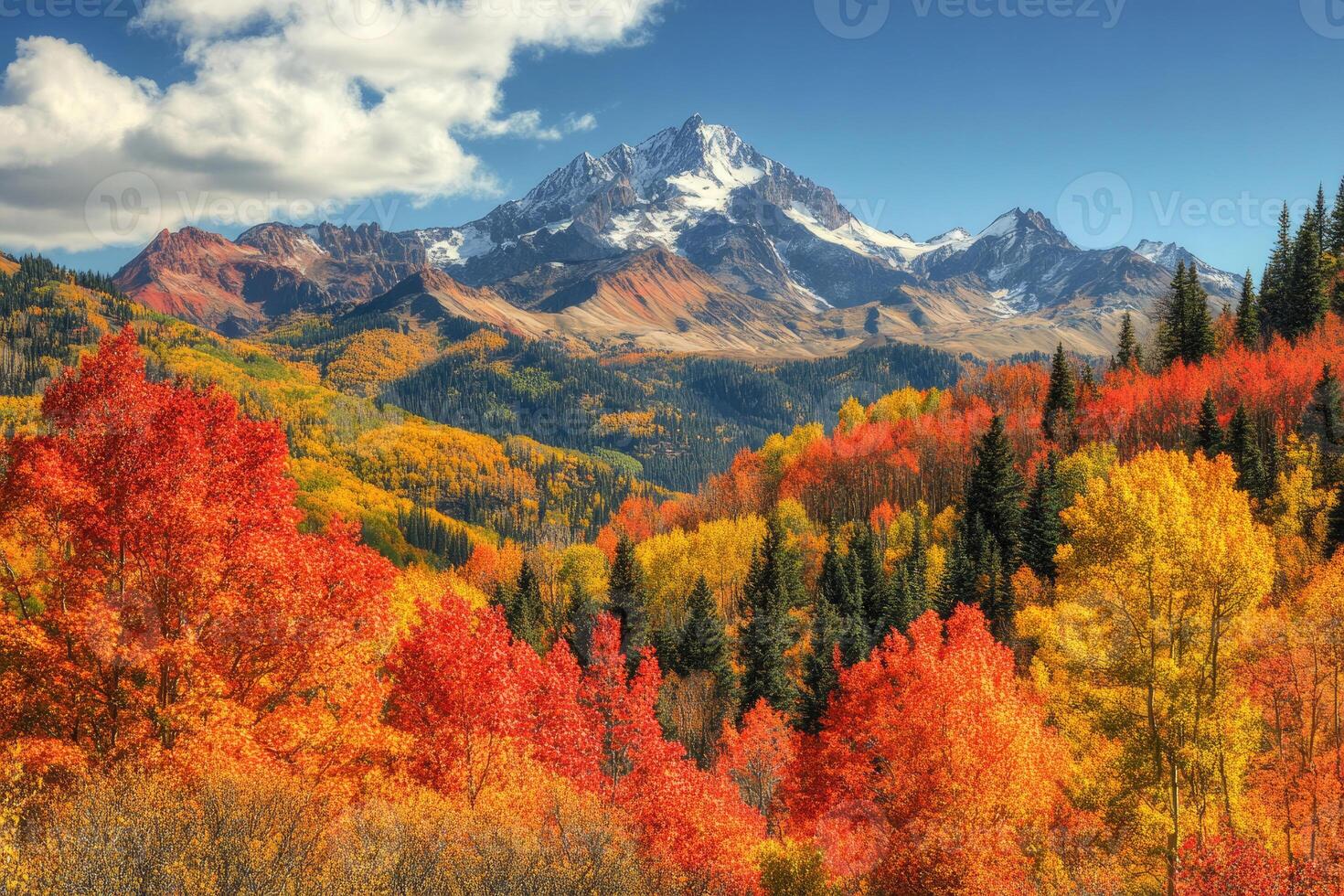 A breathtaking mountain range adorned with autumn colors. photo