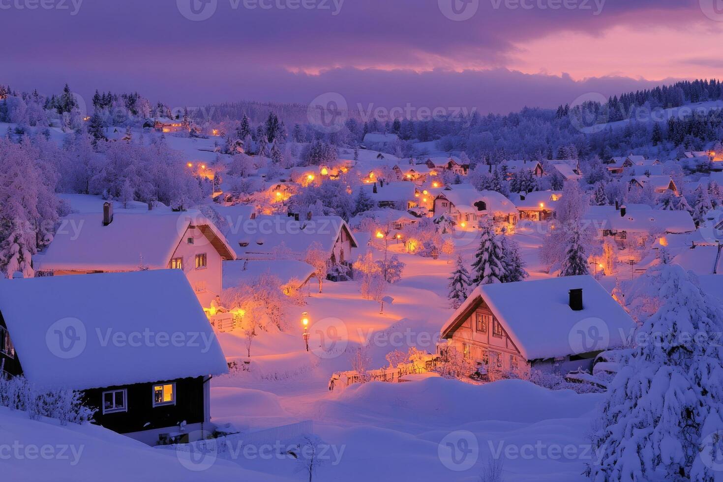 A quaint village blanketed in snow as the sun sets. photo