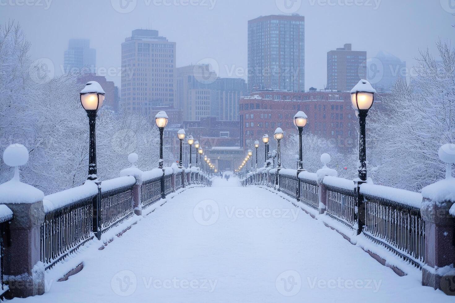 A city bridge covered in snow with the skyline in the background. photo