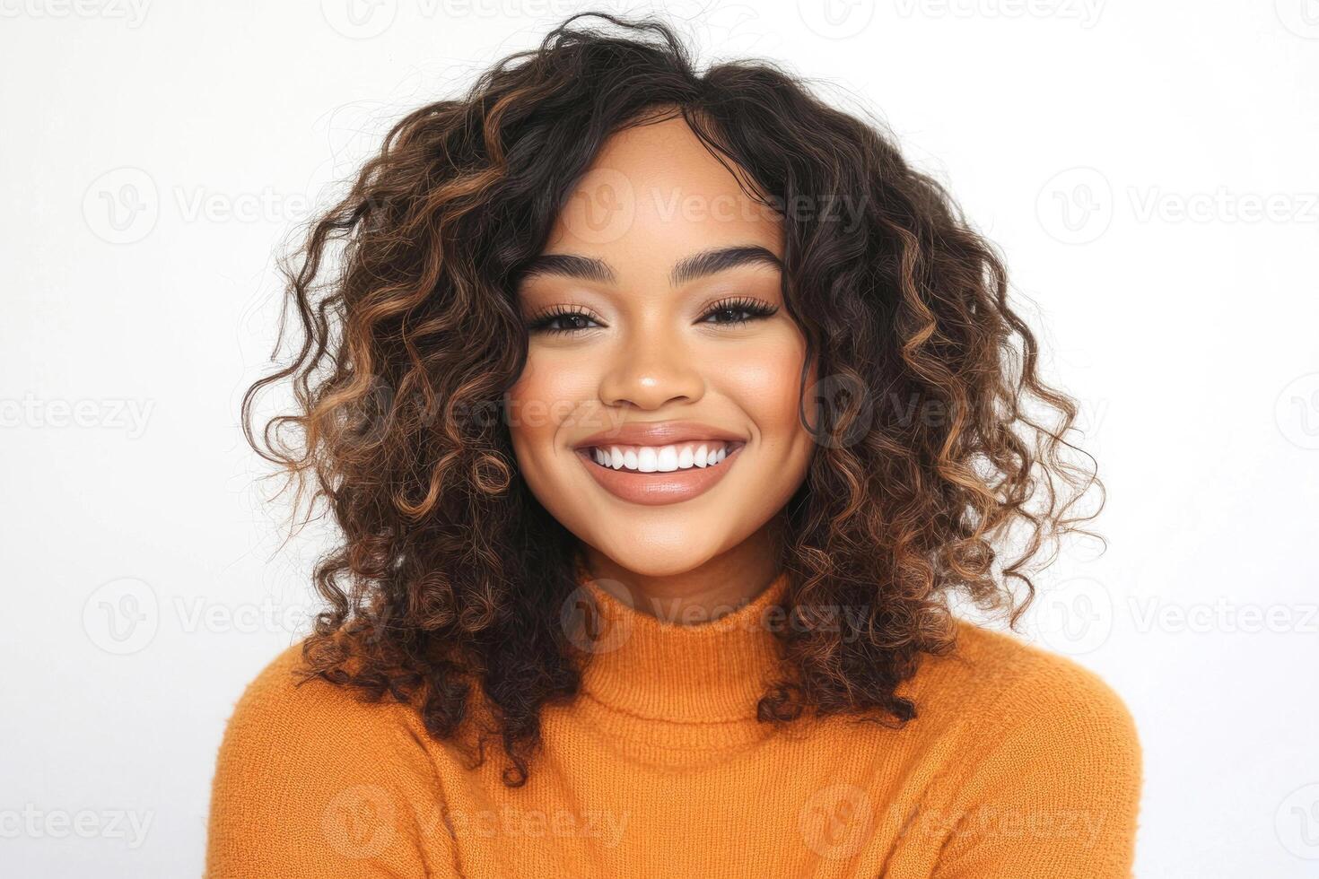 Smiling young woman with sock curls in a white studio. photo