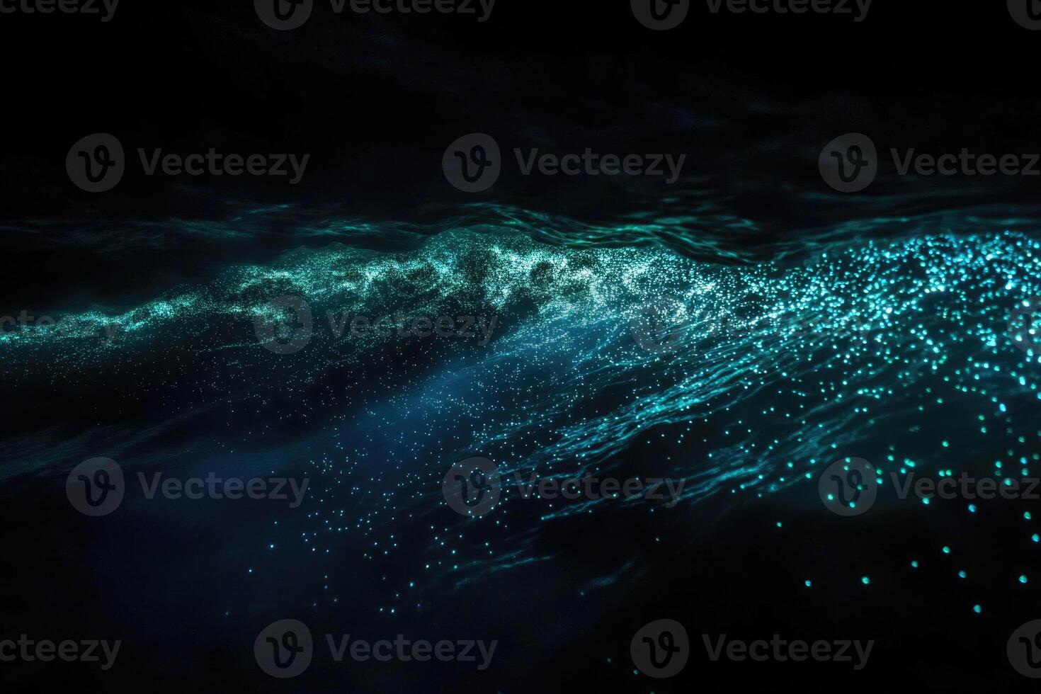 Bioluminescent plankton glow brilliantly in the dark. photo