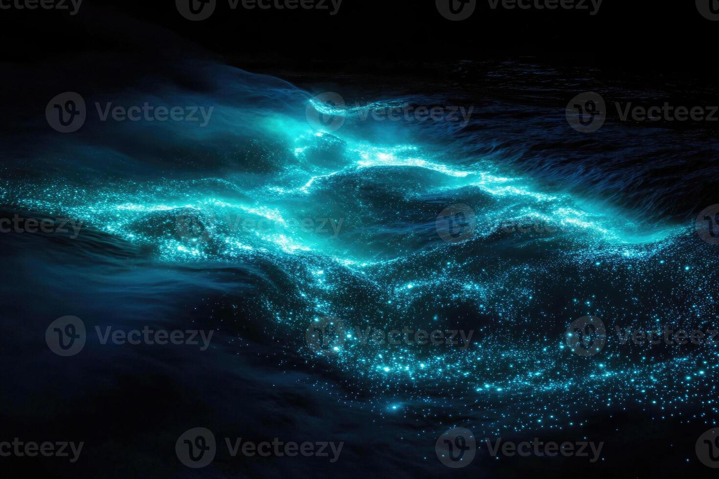 Bioluminescent plankton glow brilliantly in the dark. photo