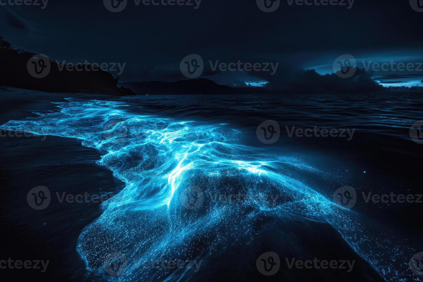 Bioluminescent plankton glow brilliantly in the dark. photo