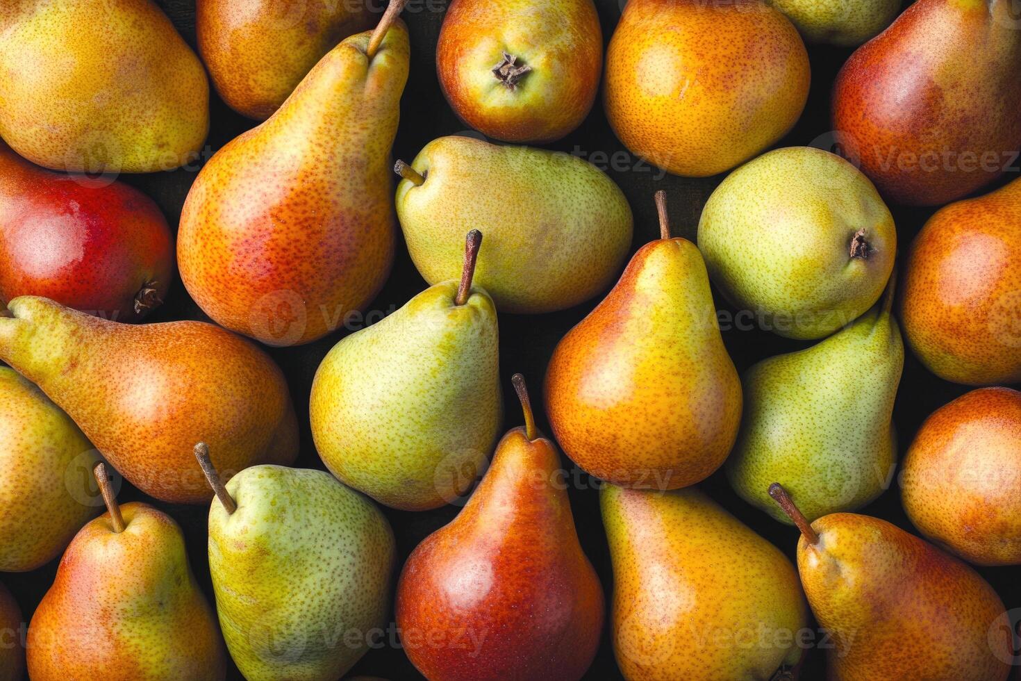 A colorful array of pears forms a rich and textured background. photo