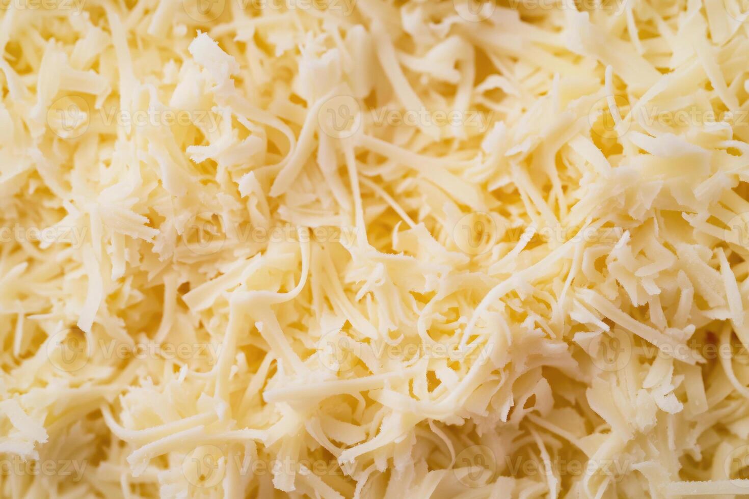 A textured layer of shredded cheese forms a rich, appetizing background. photo