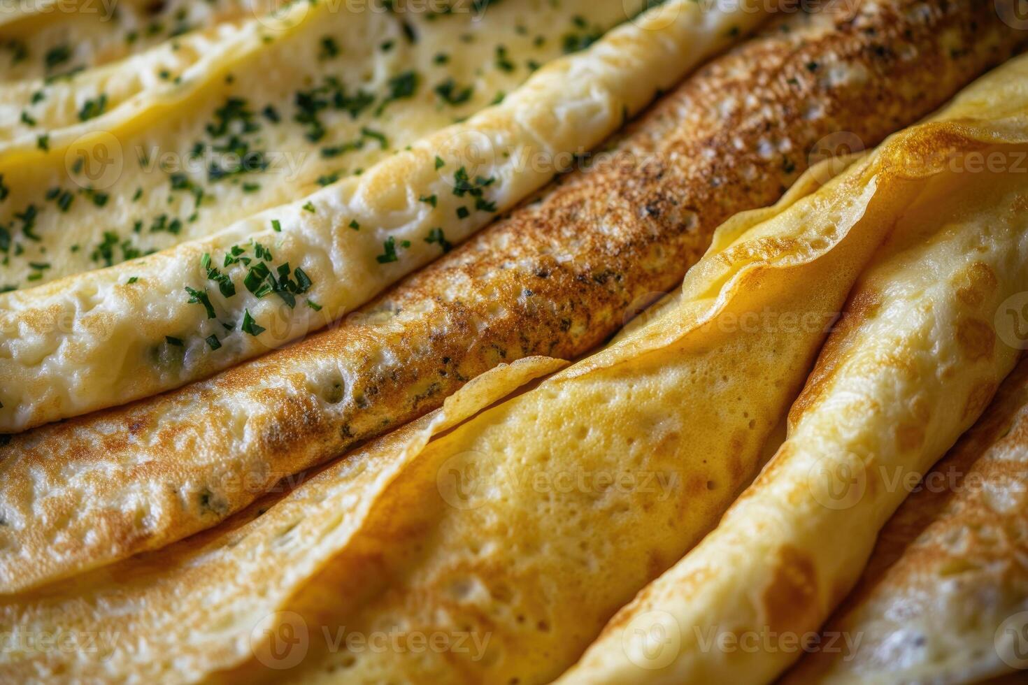 A rich array of French omelettes creates a savory, elegant background. photo