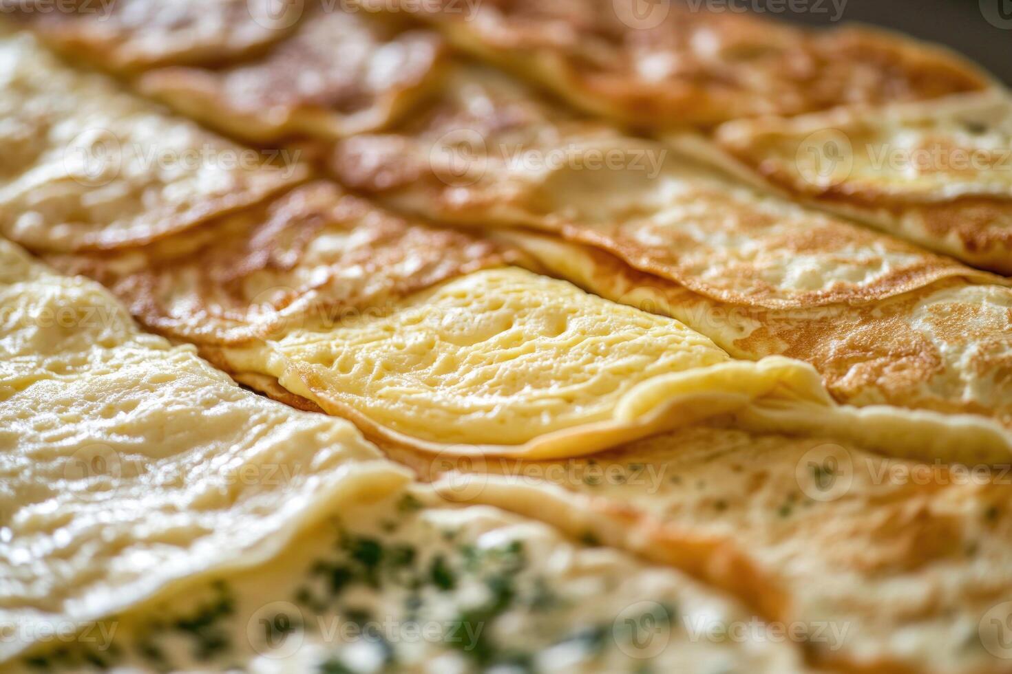 A rich array of French omelettes creates a savory, elegant background. photo