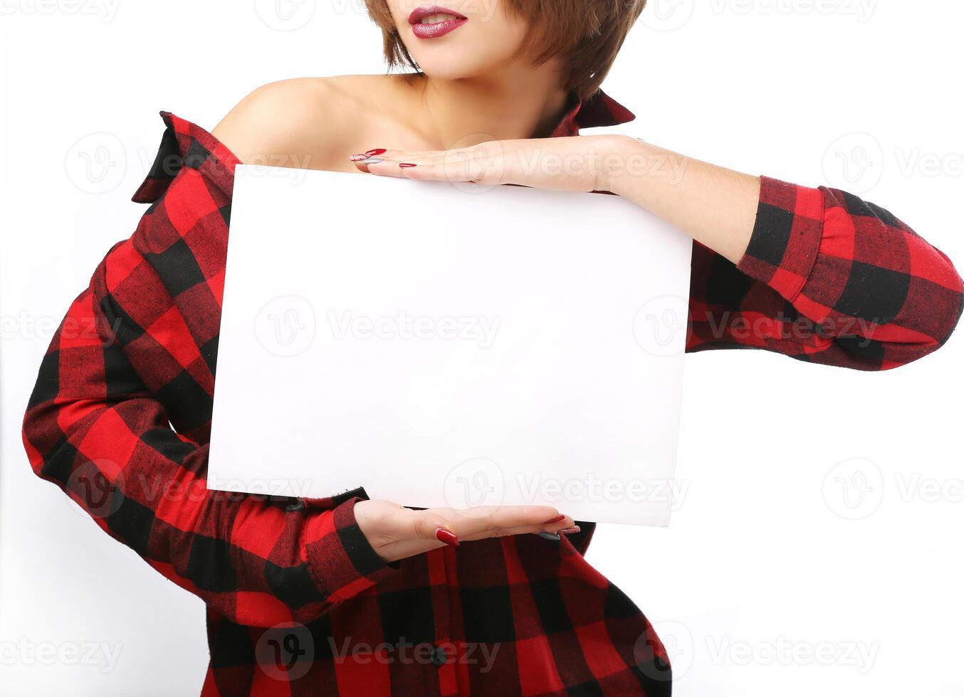 Woman holding an empty sheet of paper A4. Leaflet presentation. Pamphlet hold hands. Sheet template. Isolated over white background photo