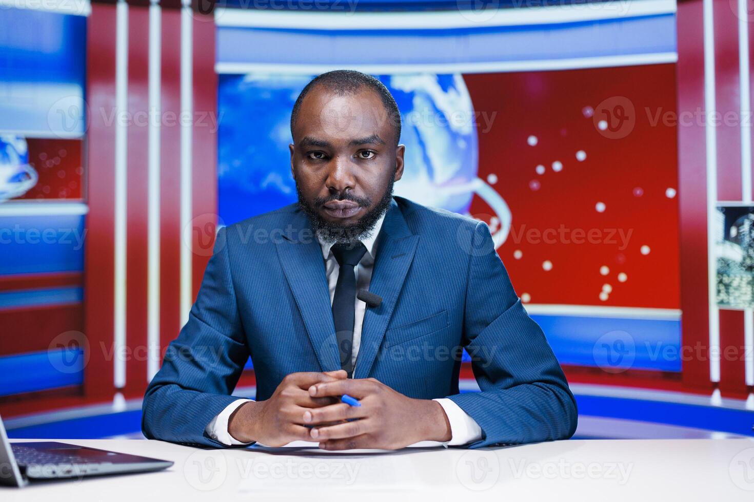 News presenter sharing latest news in studio, addressing worldwide incidents and reading headlines in newsroom. African american tv reporter working in media industry, reporting information. photo