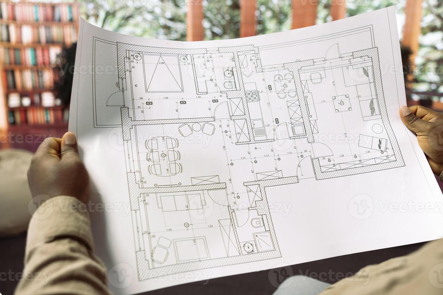 Professional entrepreneur studying architectural blueprints and hunting new real estate for office space relocation, Planning an investment strategy by leasing property, business growth. photo