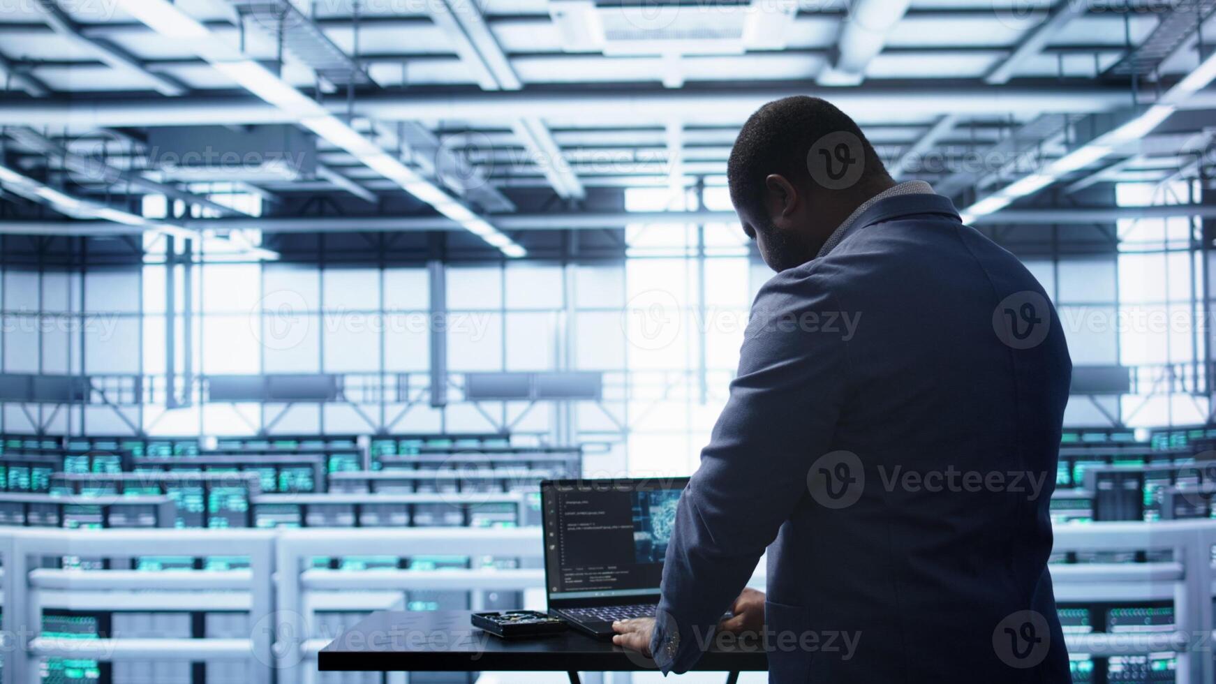 Artificial intelligence technology simulating human brain used by engineer in data center. Worker working on digital device with AI tech machine learning algorithms, camera B photo