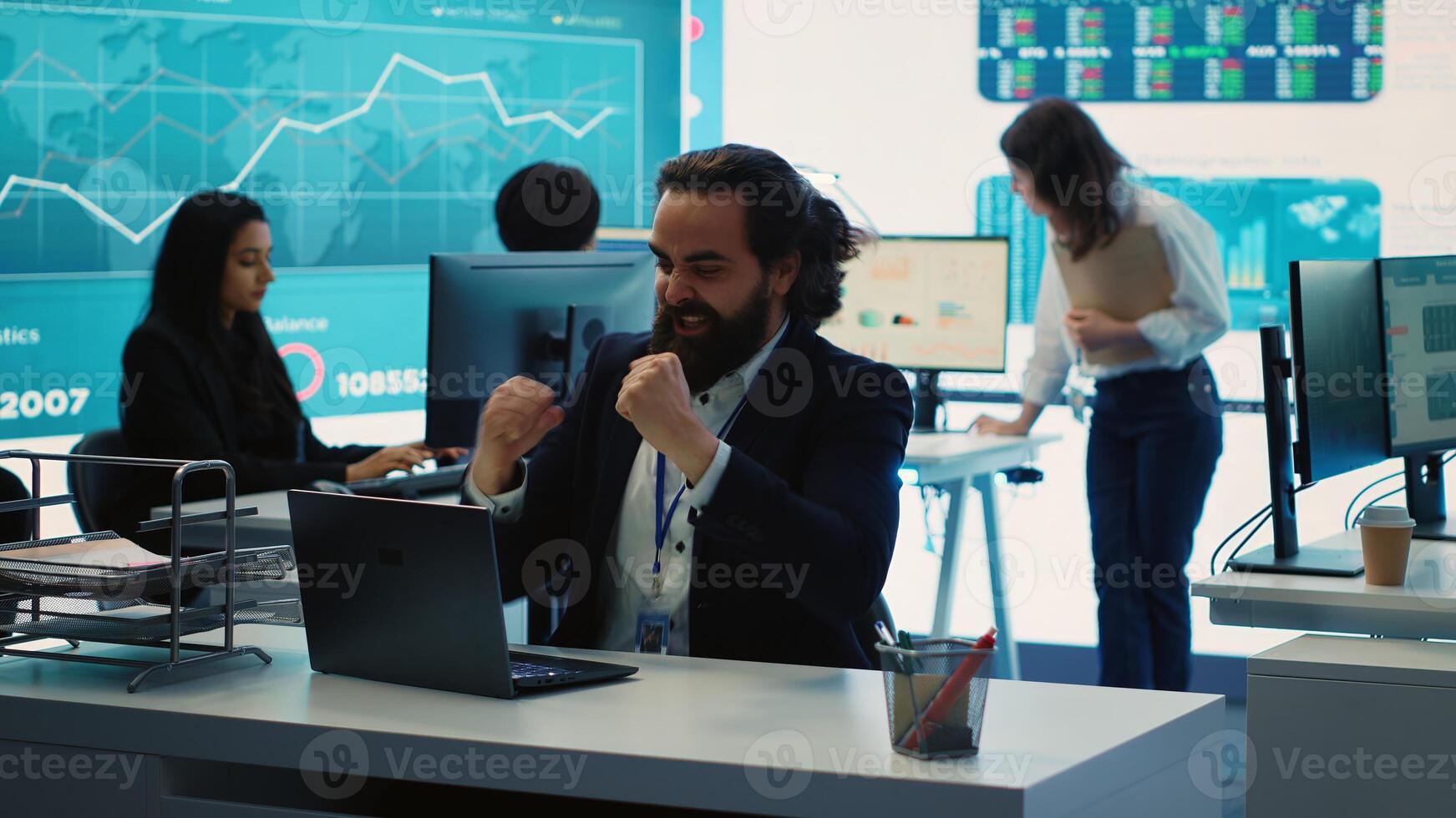 Happy CEO showing his satisfaction and celebrating business success, obtaining more funds to expand internationally. General manager dancing around and doing high five with his team. Camera A. photo