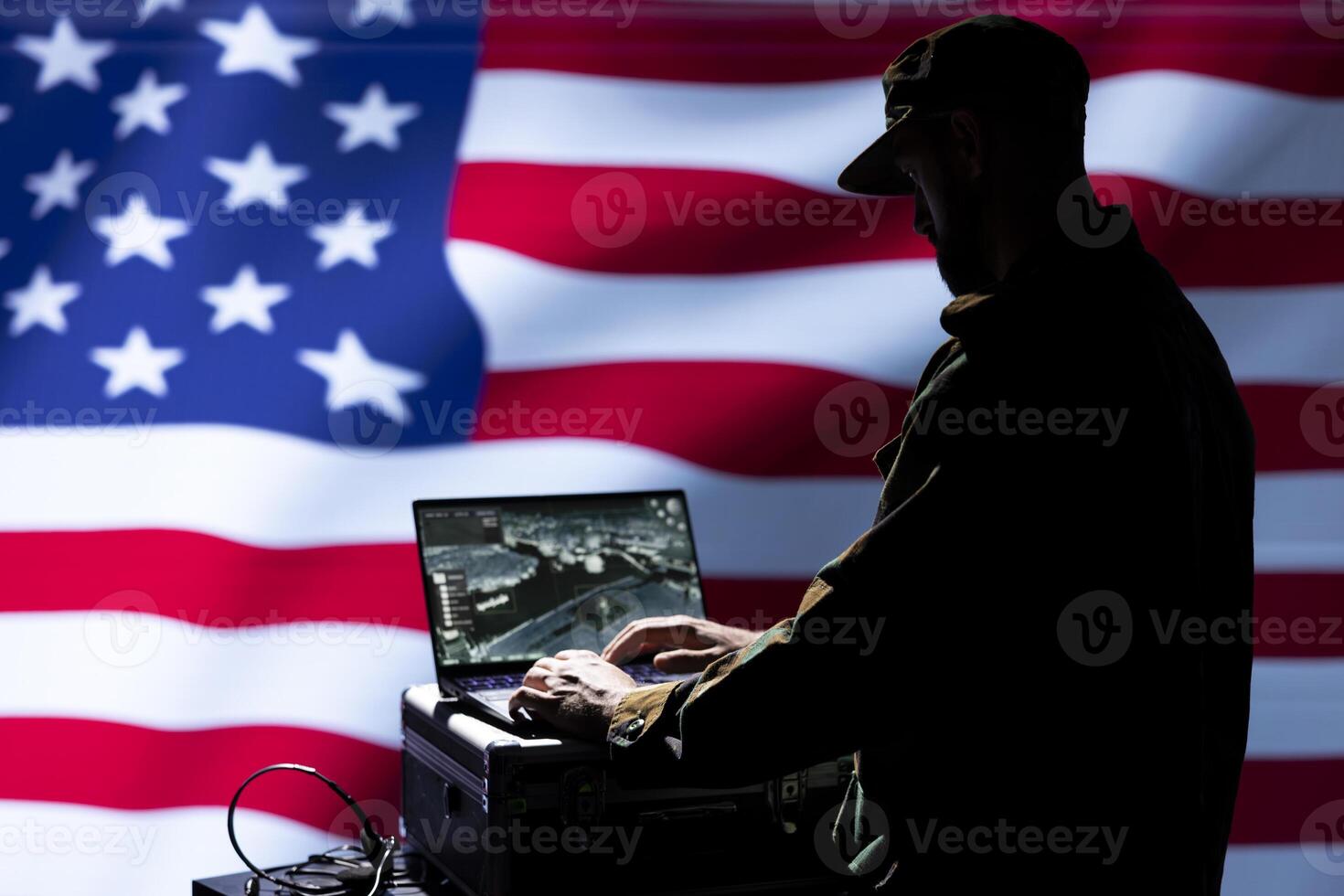 US Air Force soldier defending democracy and helping protect national aerial space. United States army officer trained to defend his nation and citizens, using tracking system on laptop photo