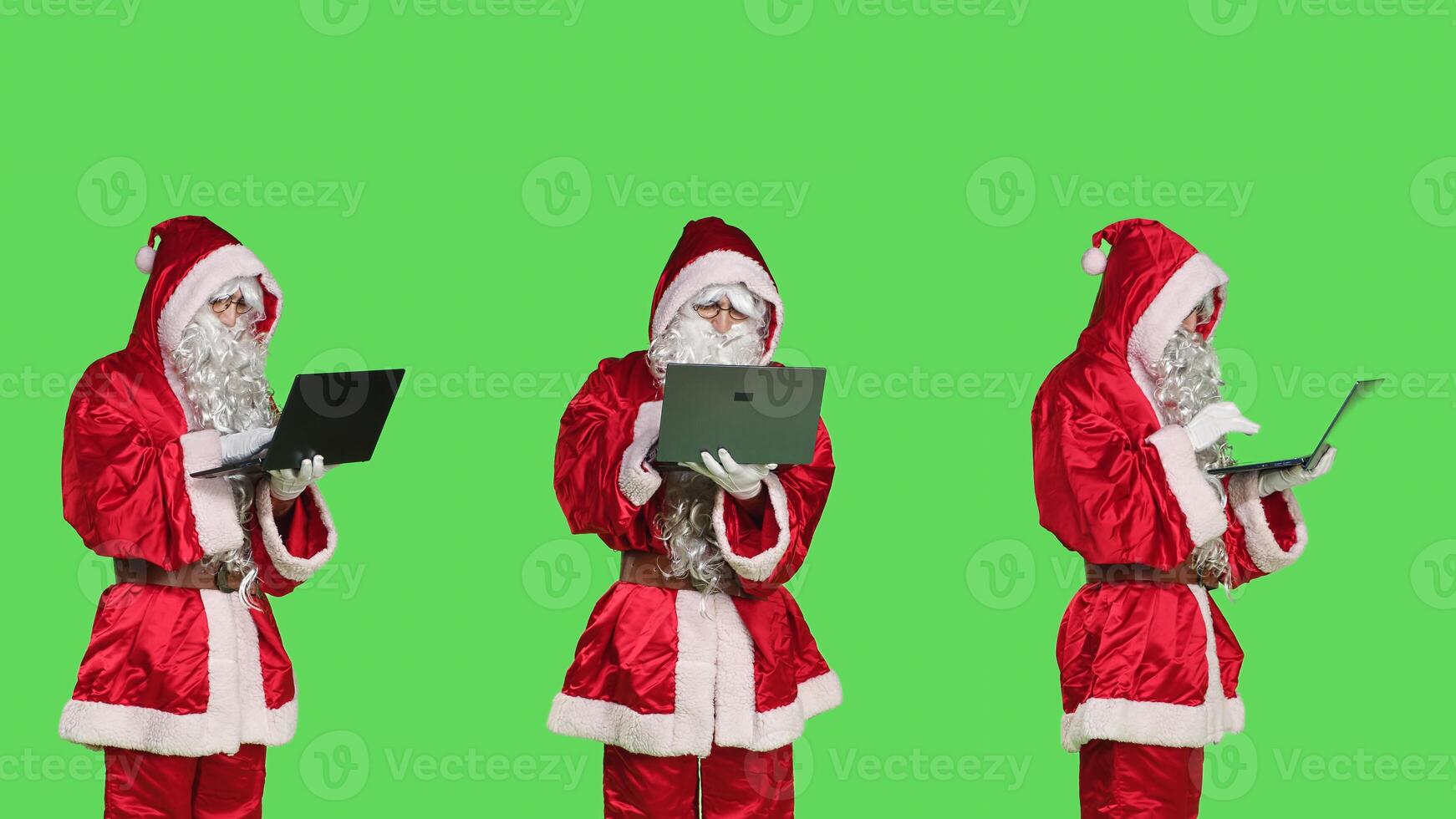 Cool santa claus character with laptop, checking xmas naughty or nice list of children against greenscreen backdrop. Modern person portraying father christmas using wireless pc. photo