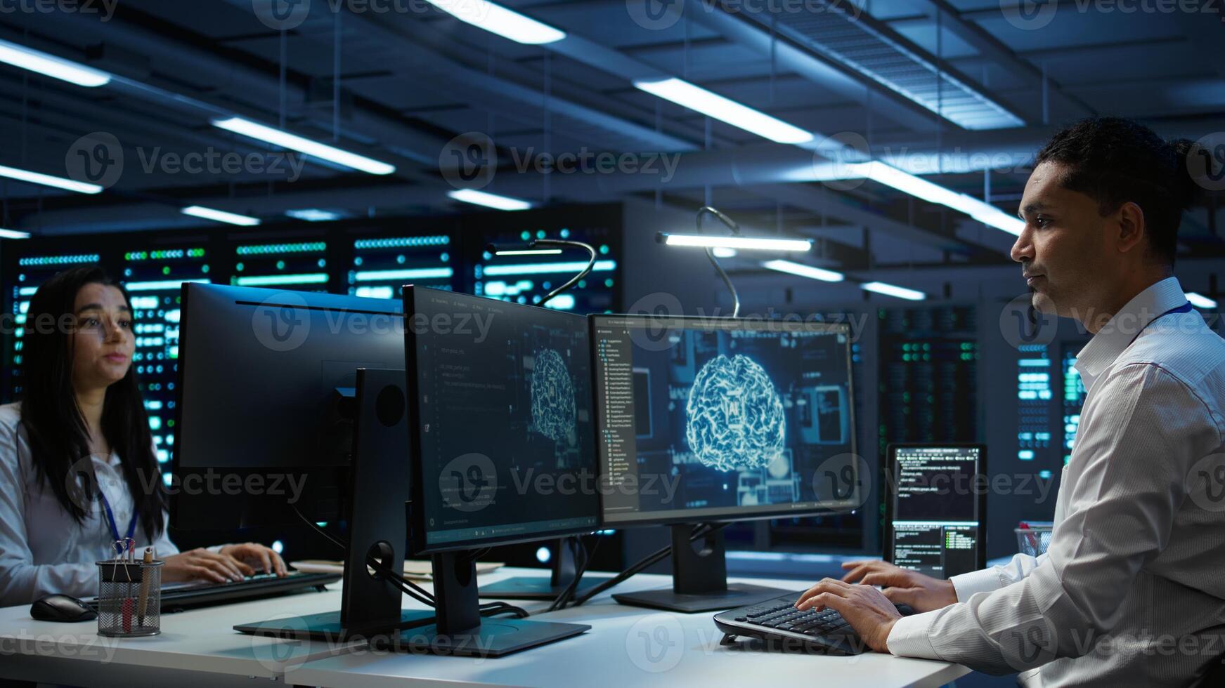 Computer scientist using AI tech on PC to do checkup in server room. IT staff member in data center using artificial intelligence technology to process datasets for training, camera B photo