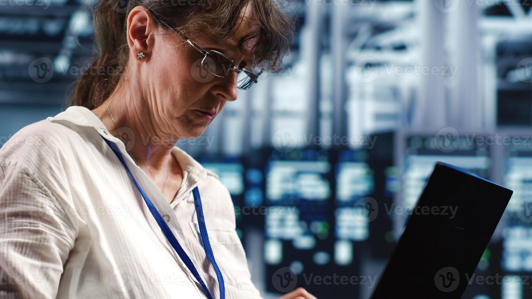 Precise professional working in server farm housing GPU dedicated supercomputers that can process AI tasks with high efficiency, reconditioning inoperational rigs used for machine learning photo