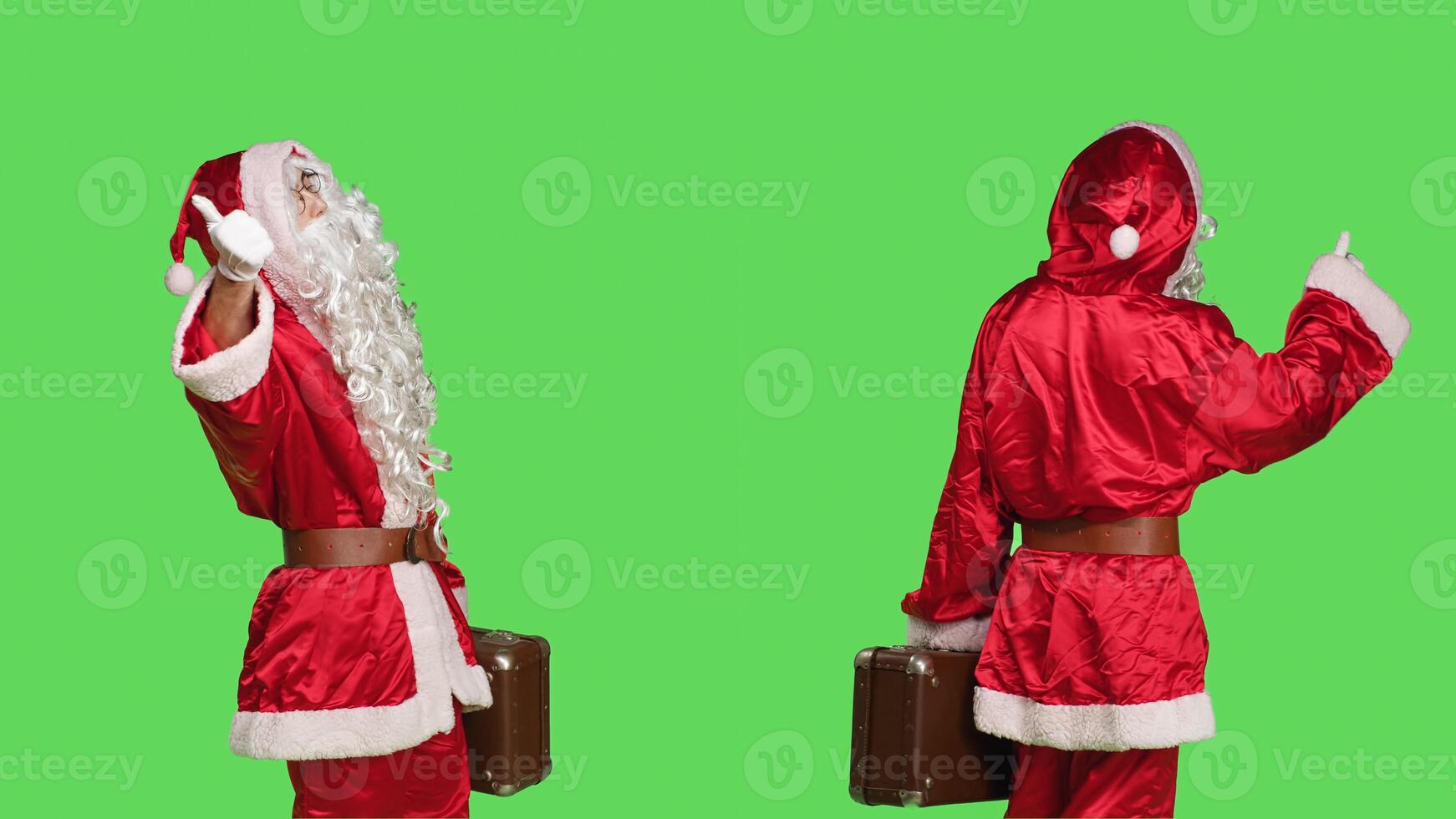 Santa claus with briefcase hitchhiking over greenscreen backdrop, asking to go somewhere while he is wearing festive costume with hat and beard. Confident man in cosplay suit with suitcase. photo
