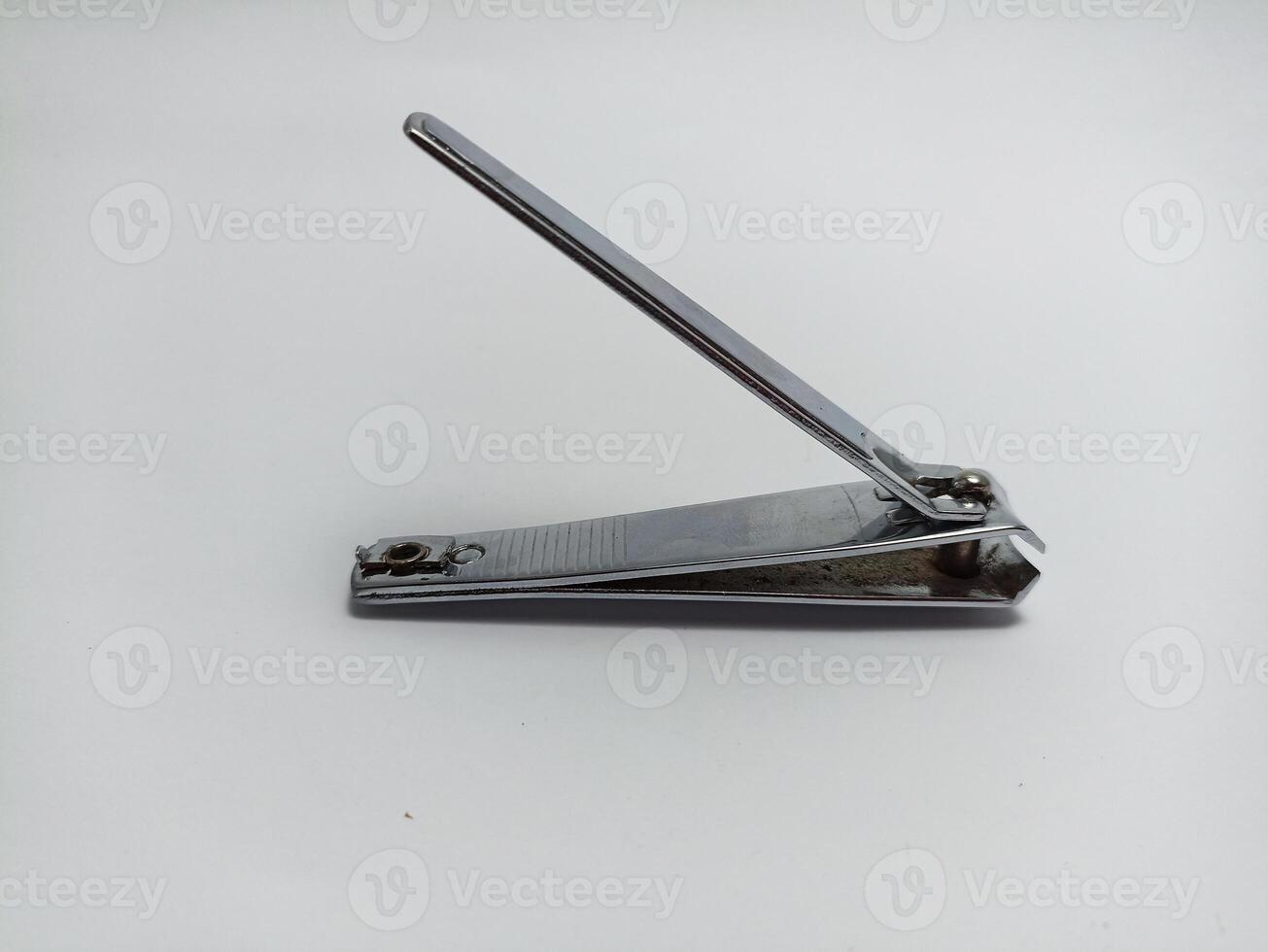 silver nail clippers on a white background, to cut your fingernails and toenails so they are clean photo
