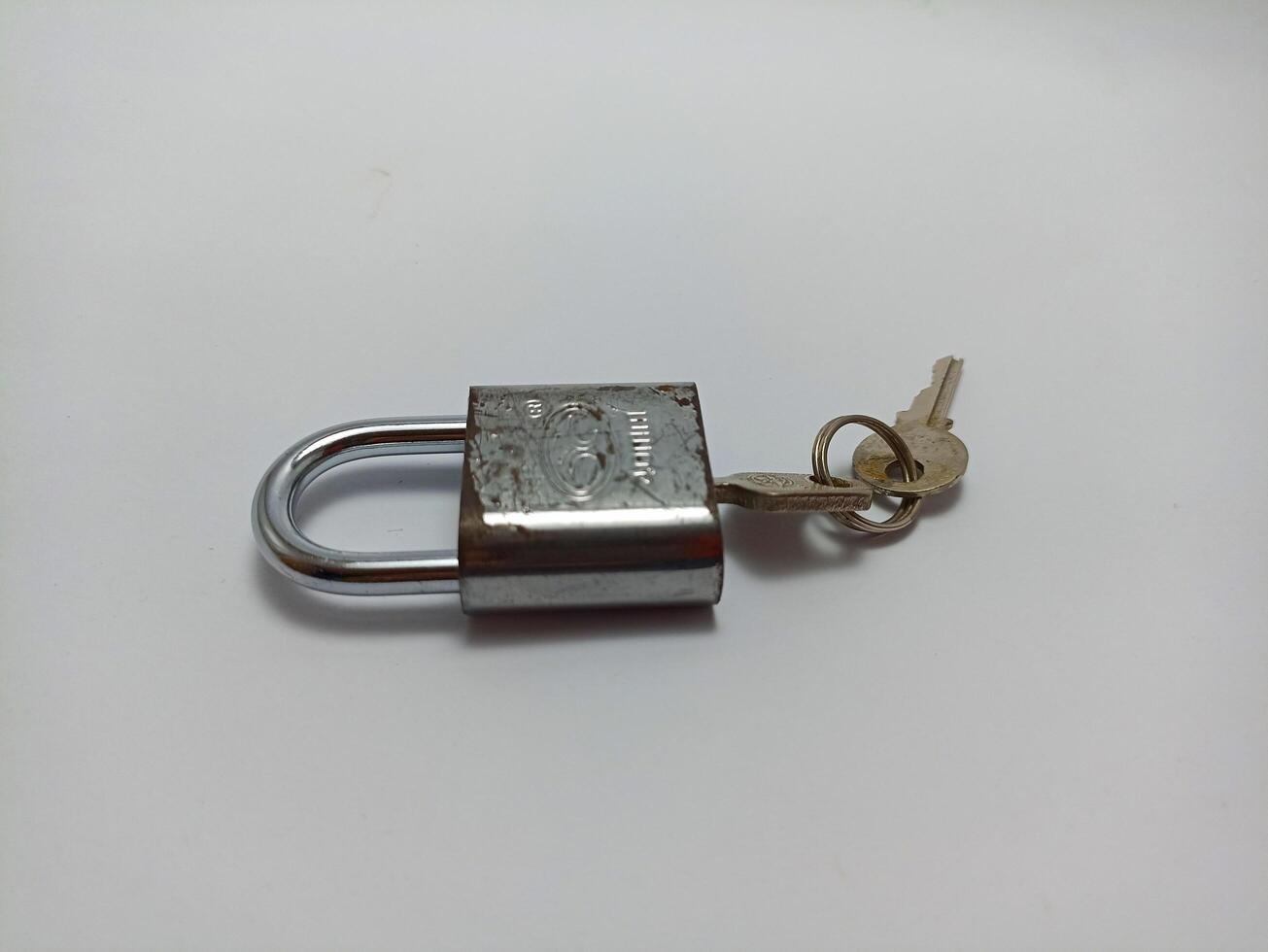 Wonosobo, Central Java, Indonesia July 29, 2024 padlock and key on white background photo